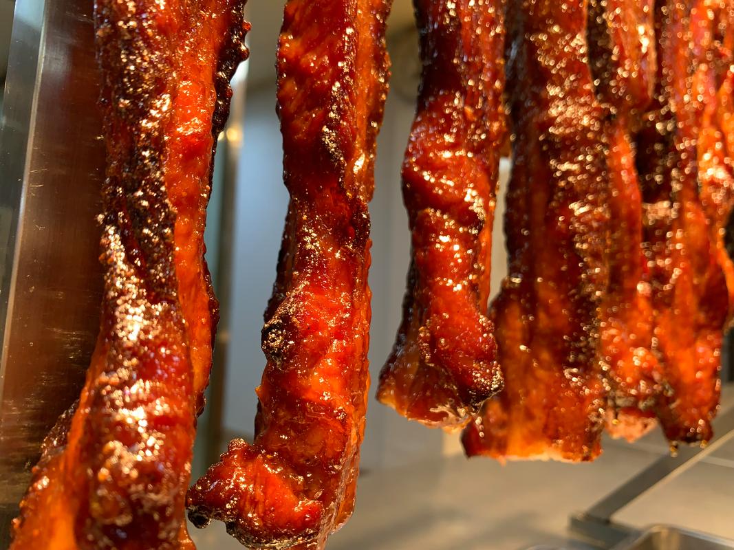 Char Siu — glossy Cantonese barbecued pork strips with signature red glaze and charred edges