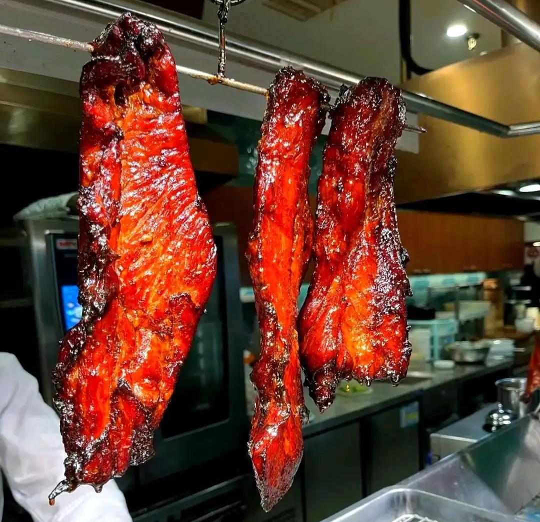 Char Siu — glossy Cantonese barbecued pork strips with signature red glaze and charred edges