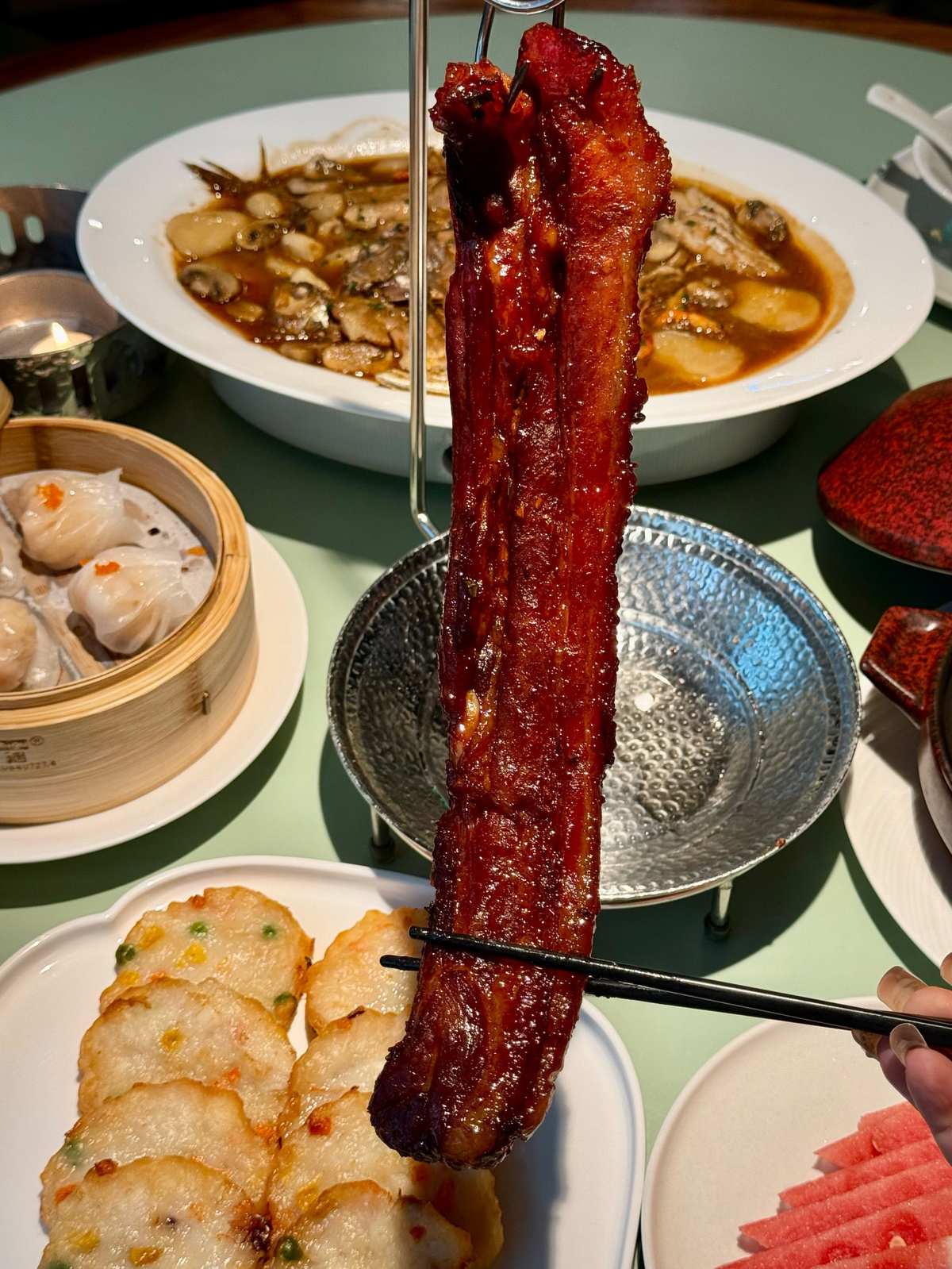 Char Siu — strips hanging in a traditional Cantonese BBQ shop window