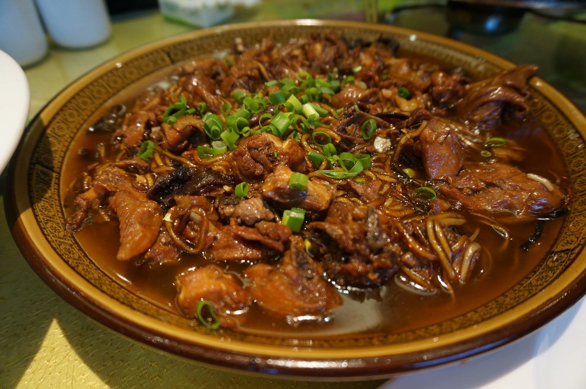 Chicken & Mushroom Stew — a wide ceramic bowl of soy-braised chicken and rehydrated wild mushrooms, scallions scattered over the top