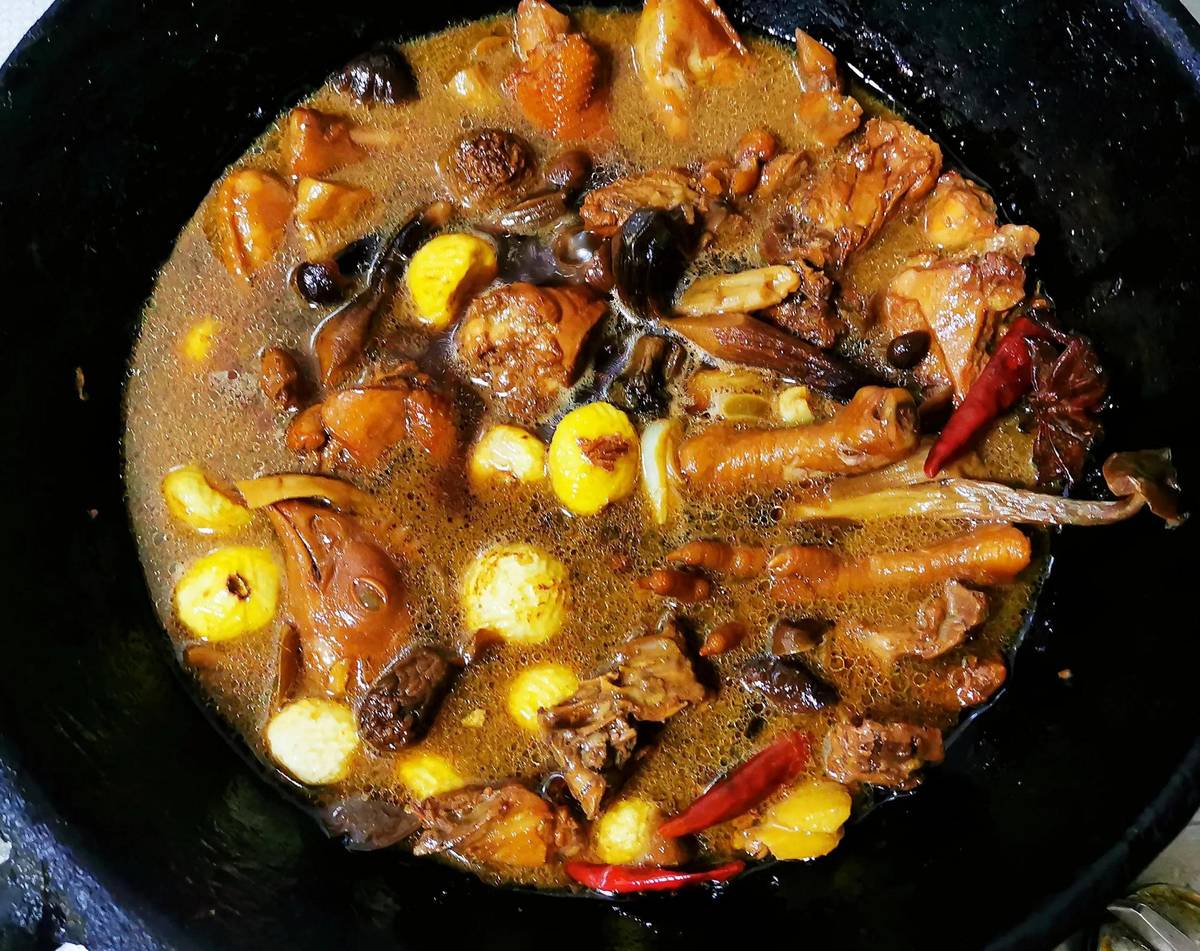 Chicken & Mushroom Stew in the pot — a wok of braised chicken and mushrooms, still bubbling on the stove