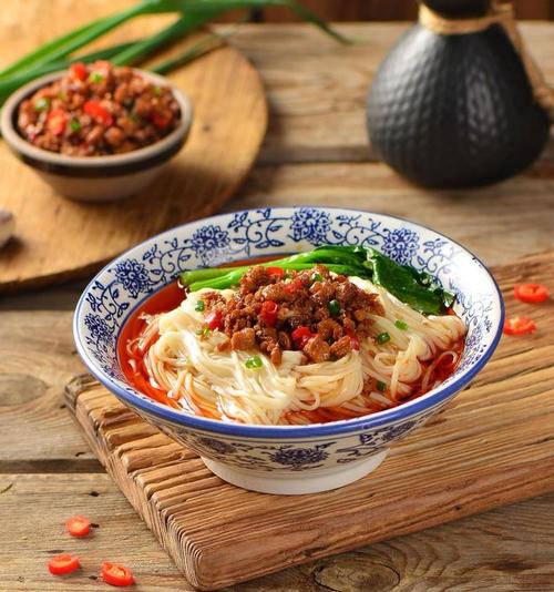 Dan Dan Noodles — the bowl as served, pork and scallions scattered on top