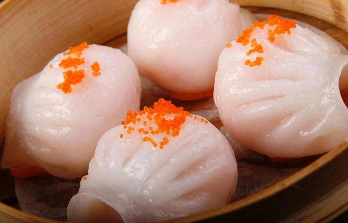 Dim Sum close-up — har gow, the pleated translucent shrimp dumpling, sitting in its steamer