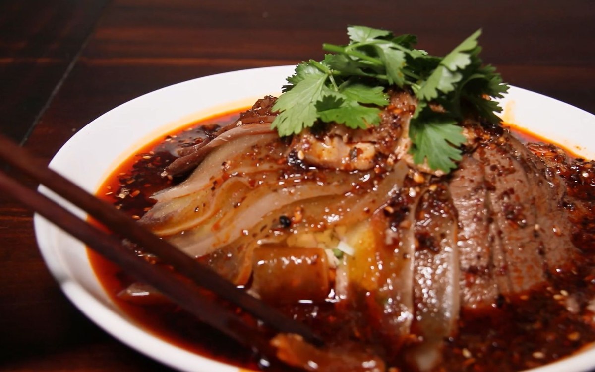 Fuqi Feipian dressed and served cold, chopsticks resting on the plate