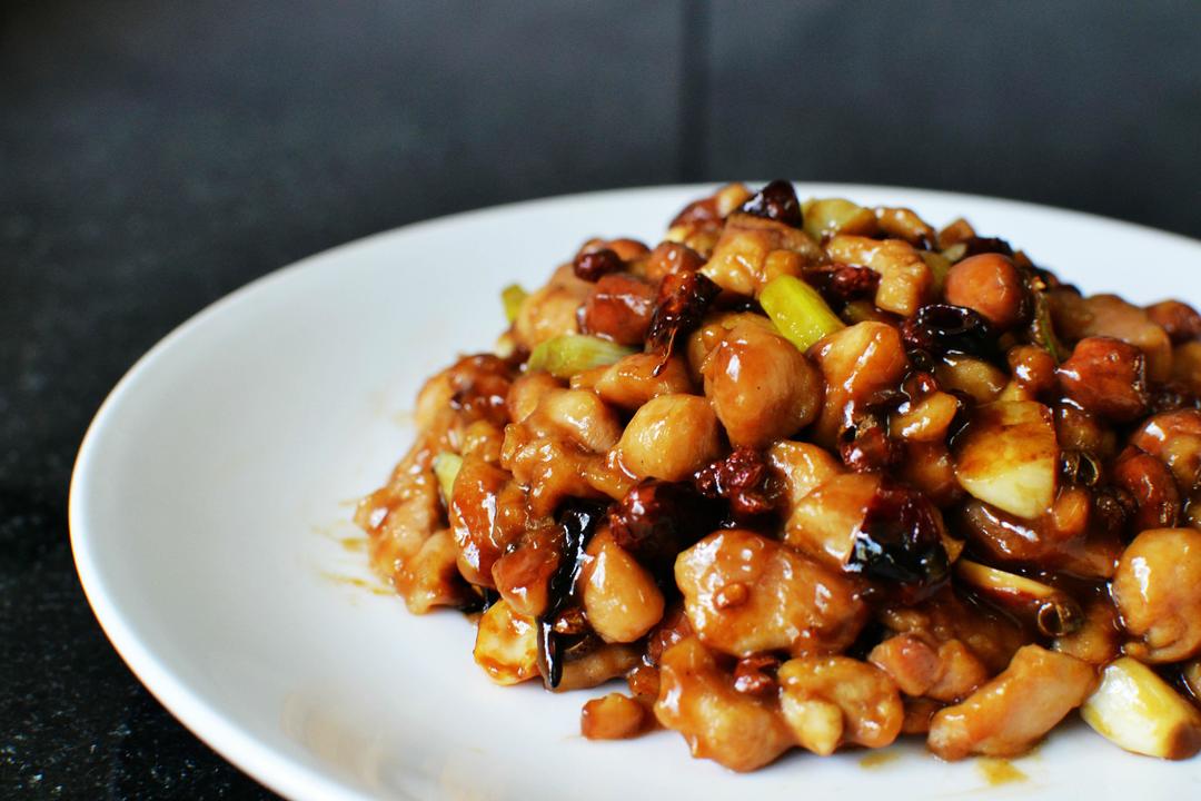 Kung Pao Chicken closeup with vibrant red chilies