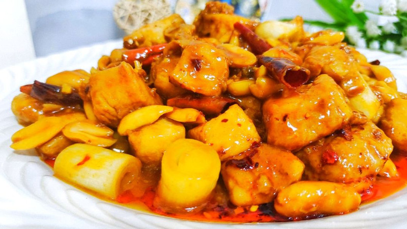 Kung Pao Chicken with rice — the sauce pooling at the bottom
