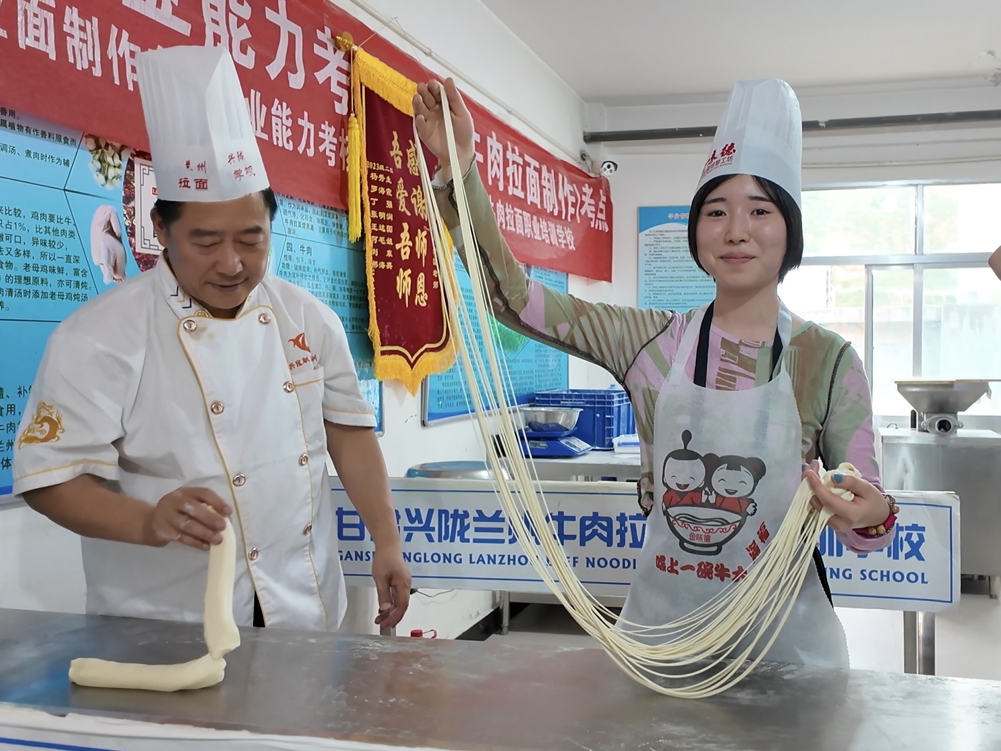 Lanzhou Beef Noodles — a master pulling dough into thin strands in a traditional shop