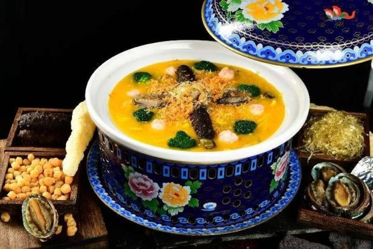 The pot plated — sea cucumber, mushroom and dried seafood in a rich gold broth