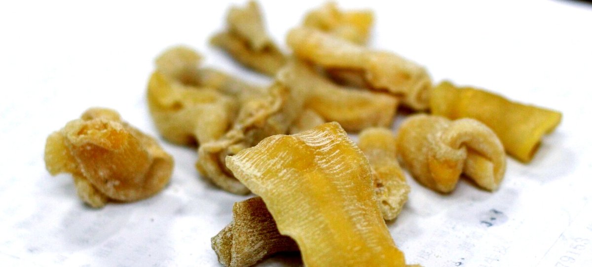Dried fish maw — the collagen that gives the pot its body without a spoon of starch