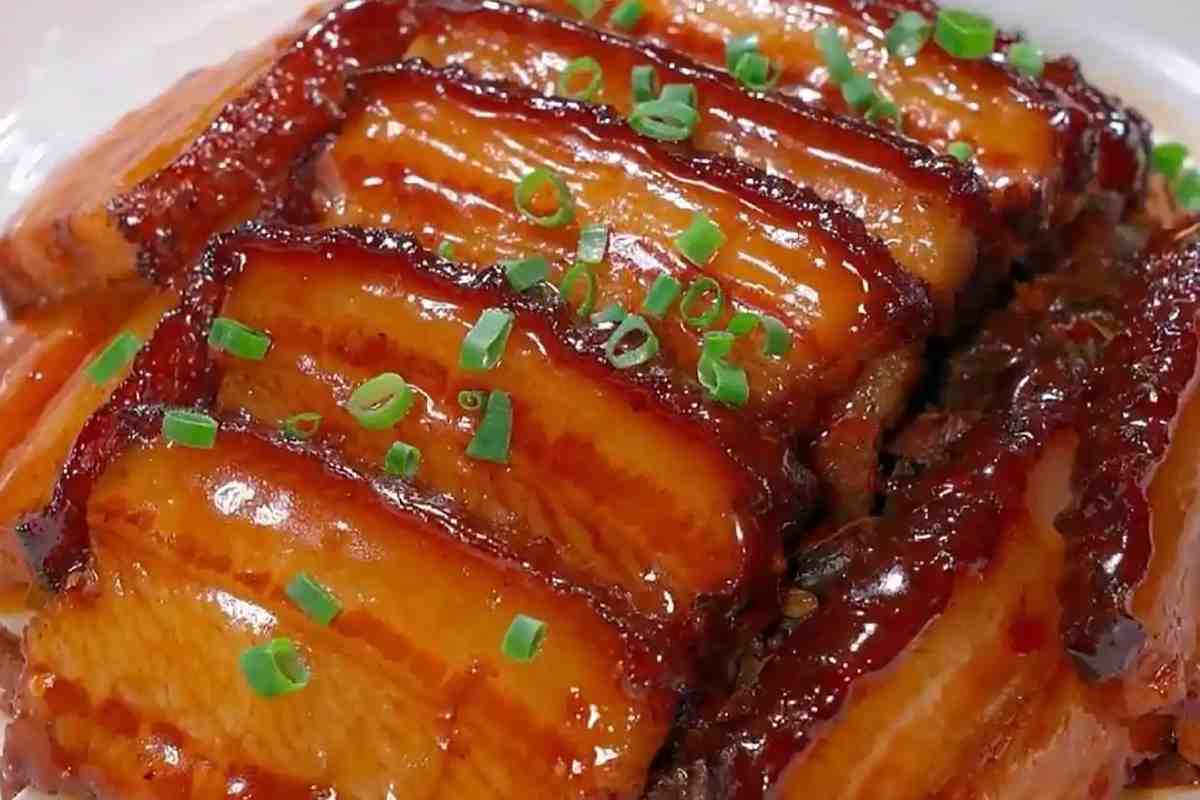 Mei Cai Kou Rou close-up — glossy pork belly with alternating layers of fat and lean meat