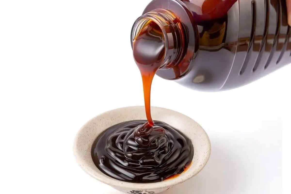 A bottle of oyster sauce — thick, dark brown, and the fastest umami shortcut in Chinese cooking