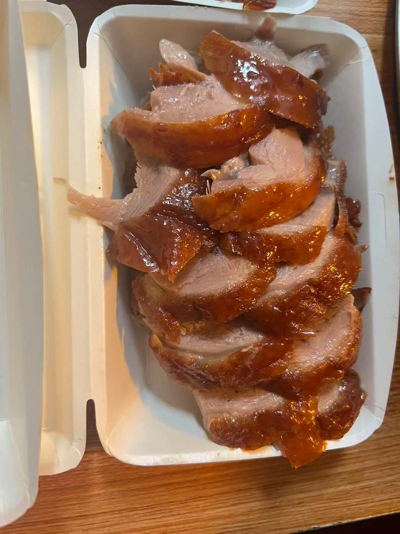 Peking Duck — glossy mahogany skin, carved tableside