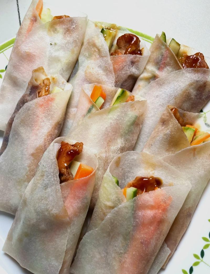 Peking Duck wrapped in thin pancakes — the essential assembly