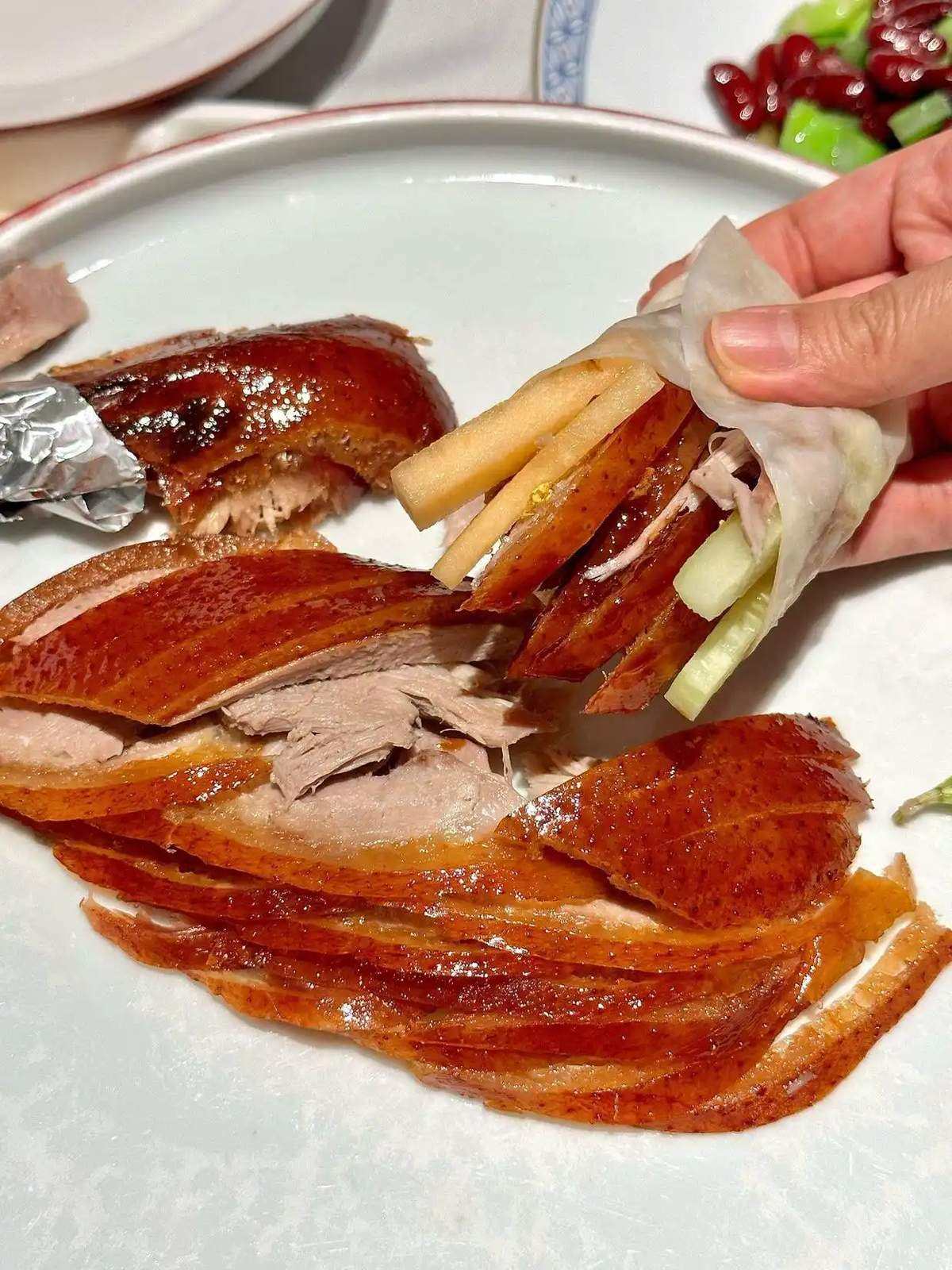 Peking Duck wrapped in thin pancakes