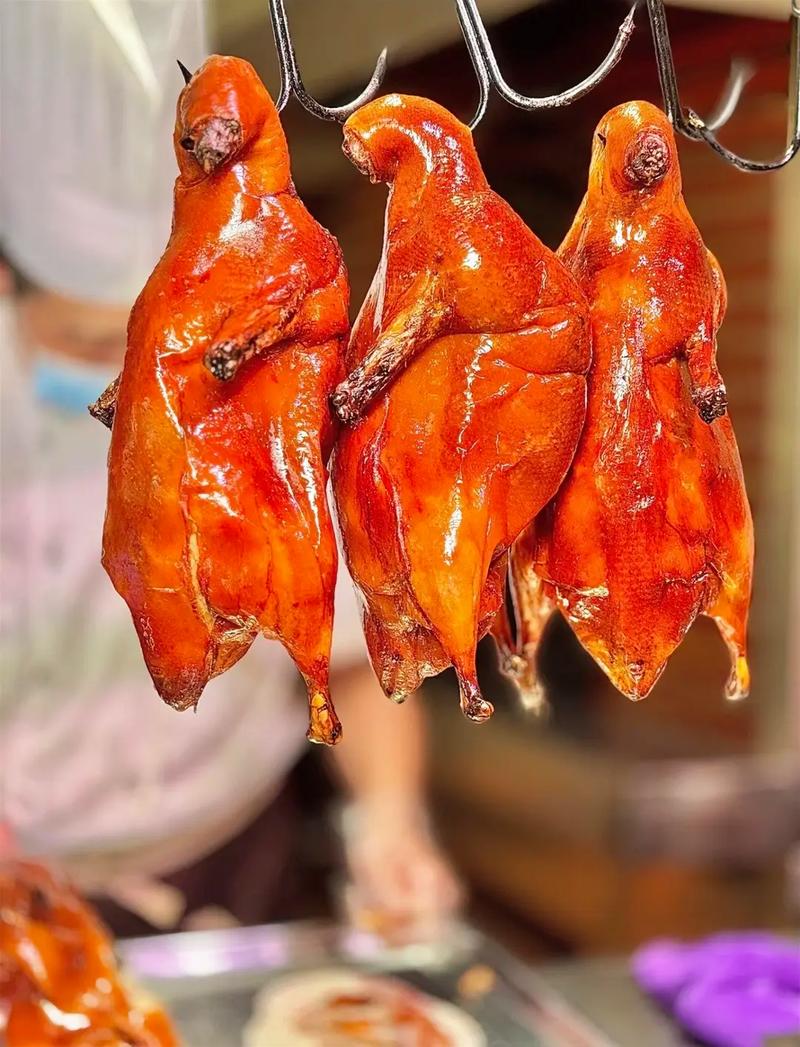 Whole Peking Duck — presentation before the cleaver falls