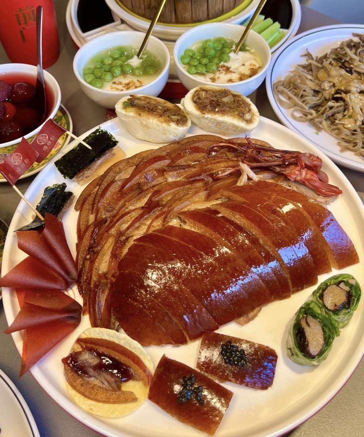 Peking Duck — glossy mahogany skin, carved tableside