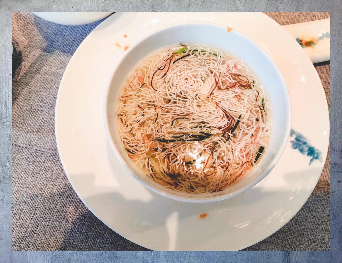 Wensi Tofu — the threads are cut so fine the bowl reads as a bowl of noodles, which is the point