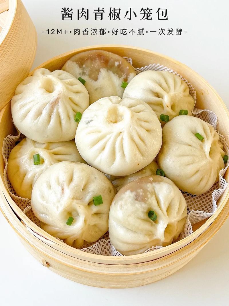 Xiao Long Bao being lifted from steamer — the proper moment, steam curling around the basket